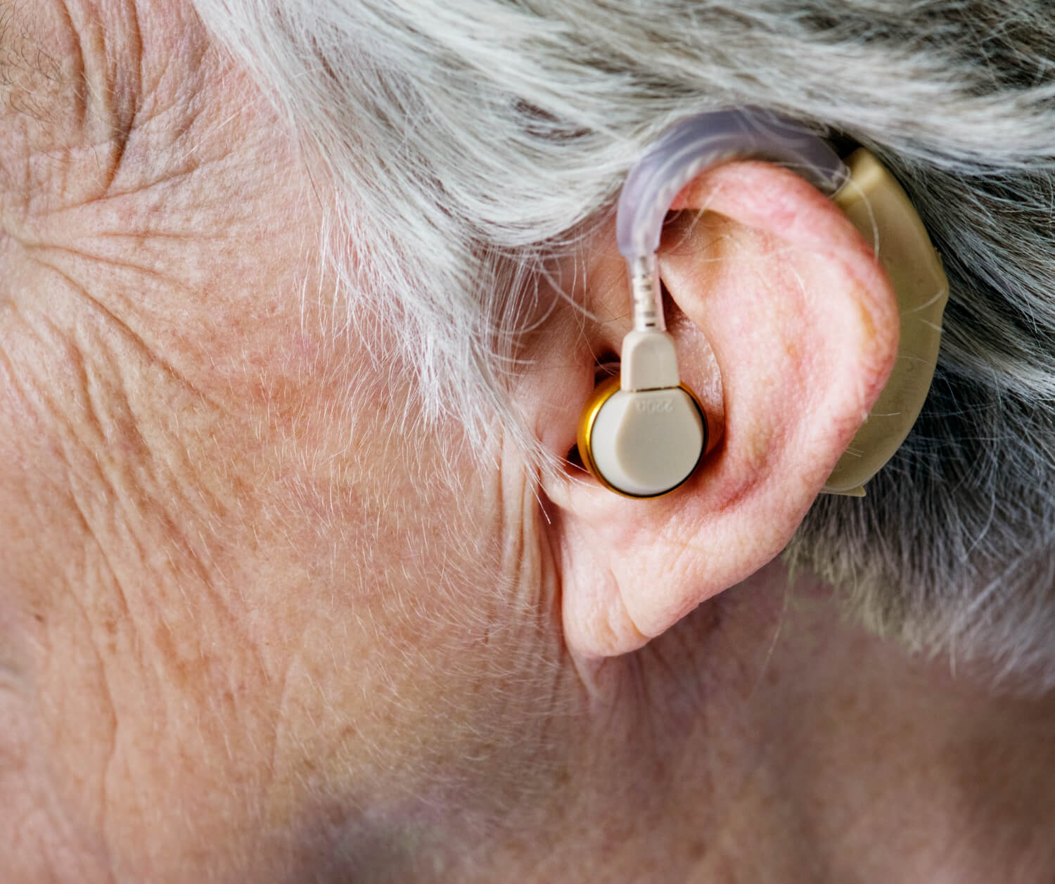 elderly-woman-wearing-hearing-aid.jpg