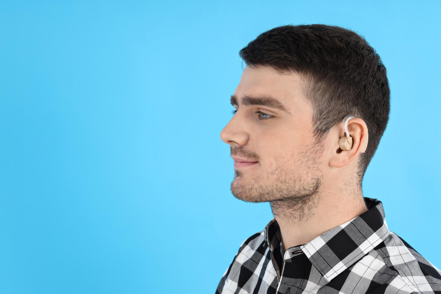 young-man-with-hearing-aid.jpg